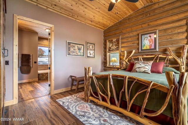 bedroom featuring lofted ceiling, hardwood / wood-style floors, rustic walls, baseboards, and wood ceiling