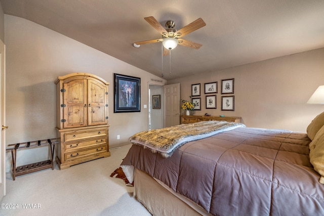 bedroom featuring light colored carpet, baseboards, a ceiling fan, and vaulted ceiling