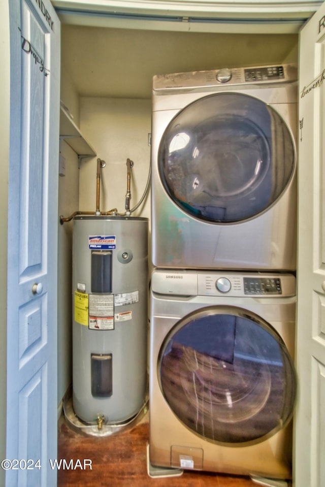 laundry room with stacked washer / dryer, wood finished floors, water heater, and laundry area