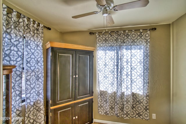 unfurnished room with a ceiling fan