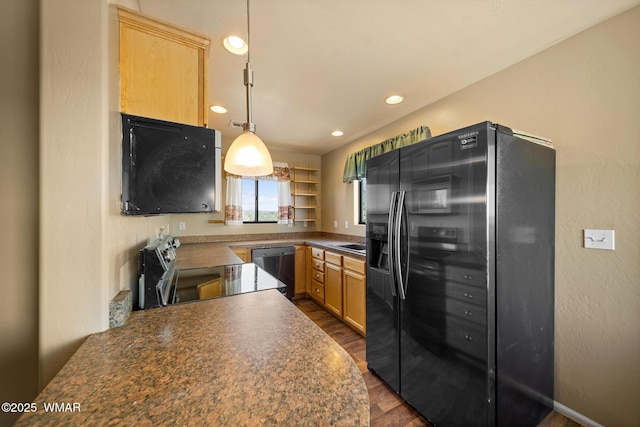 kitchen featuring dark wood finished floors, electric range, dark countertops, dishwashing machine, and black fridge