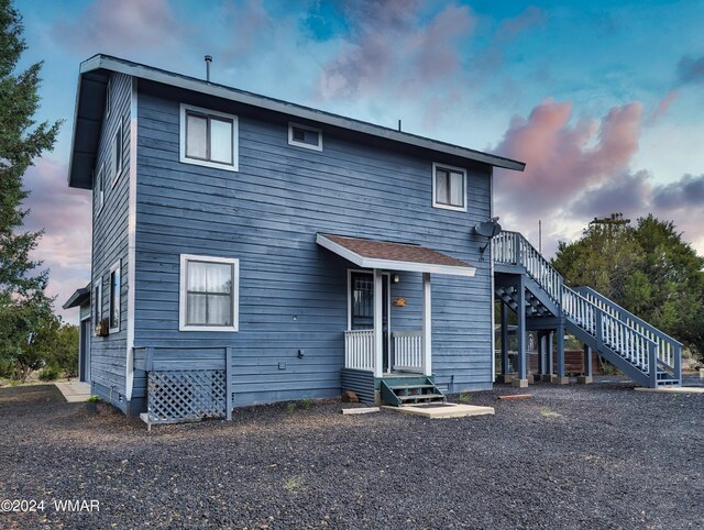 rear view of house with stairs