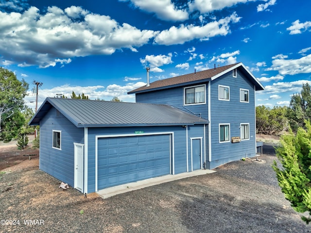 8286 Pinon Dr, Show Low, AZ 85901 - view of front of home featuring metal roof and a garage