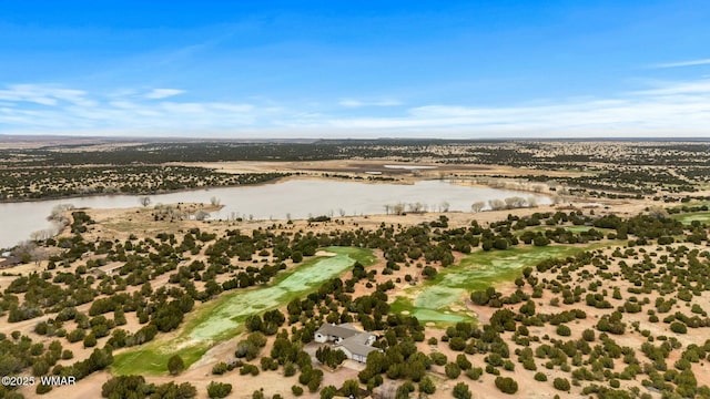birds eye view of property featuring view of golf course and a water view