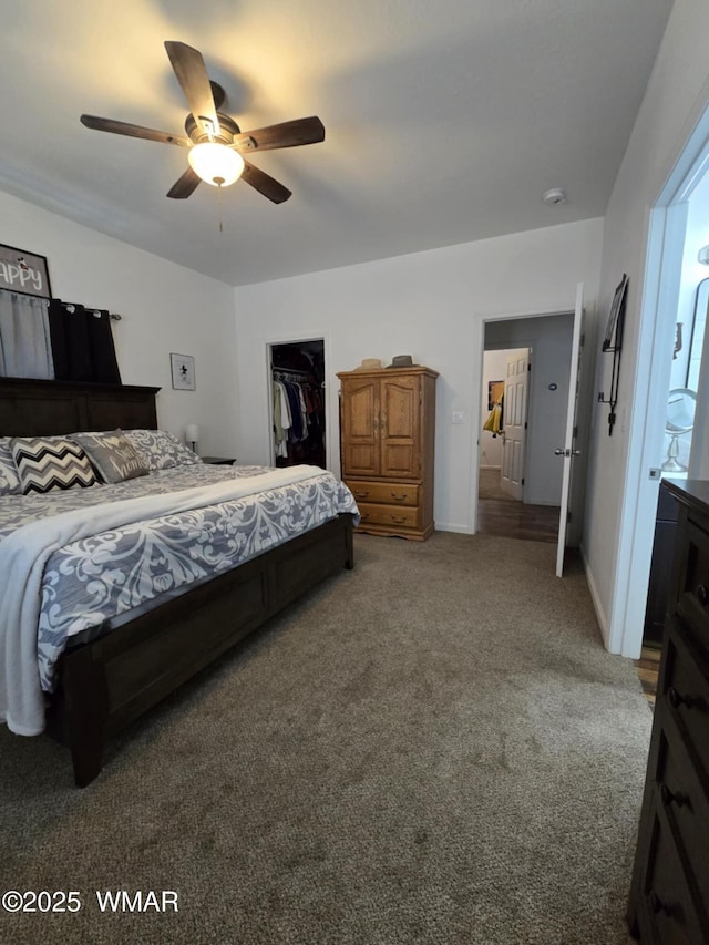 3845 Hidden Ranch Rd, Snowflake, AZ 85937 - bedroom featuring light carpet, a walk in closet, a closet, a ceiling fan, and baseboards