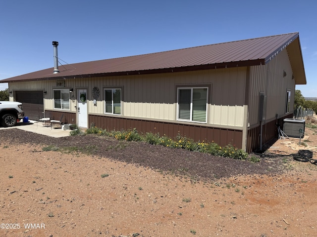 3845 Hidden Ranch Rd, Snowflake, AZ 85937 - rear view of house with an attached garage and metal roof