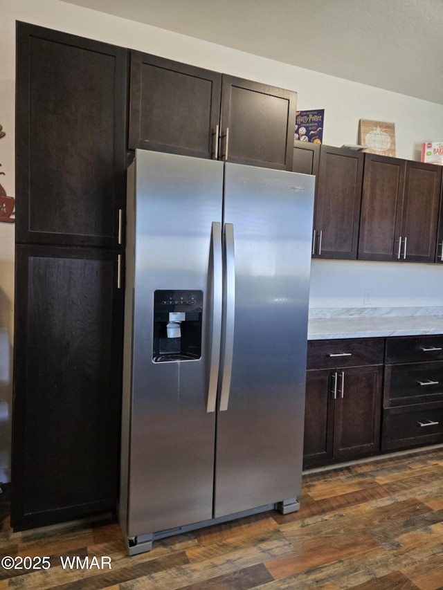 3845 Hidden Ranch Rd, Snowflake, AZ 85937 - kitchen with stainless steel fridge, dark wood-style flooring, dark brown cabinetry, and light stone countertops