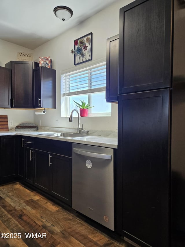 3845 Hidden Ranch Rd, Snowflake, AZ 85937 - kitchen with stainless steel dishwasher, a sink, dark wood-style flooring, and light countertops