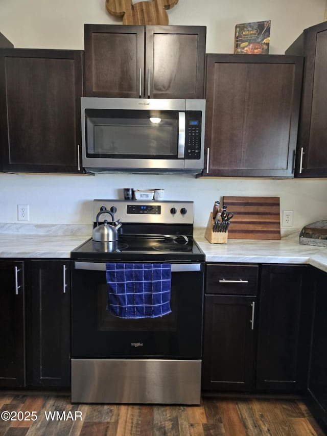 3845 Hidden Ranch Rd, Snowflake, AZ 85937 - kitchen featuring appliances with stainless steel finishes, dark wood-type flooring, and dark brown cabinetry