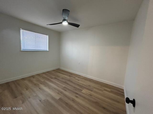 242 E 7th Ave, Eagar, AZ 85925 - unfurnished room with wood finished floors and a ceiling fan