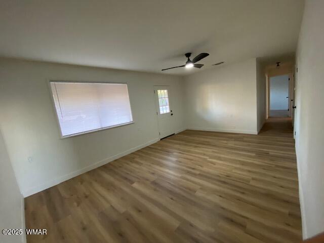 242 E 7th Ave, Eagar, AZ 85925 - empty room featuring wood finished floors and ceiling fan