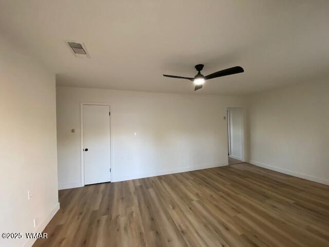 242 E 7th Ave, Eagar, AZ 85925 - unfurnished room with ceiling fan and wood finished floors