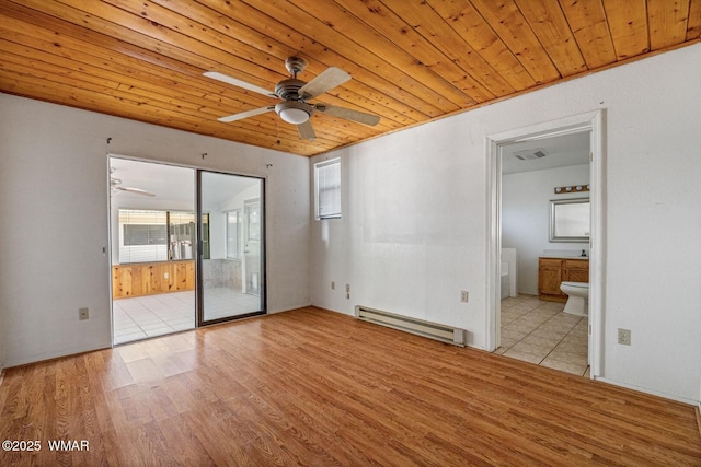 1721 W Huning, Show Low, AZ 85901 - unfurnished room featuring a baseboard heating unit, light wood-style flooring, ceiling fan, and wooden ceiling