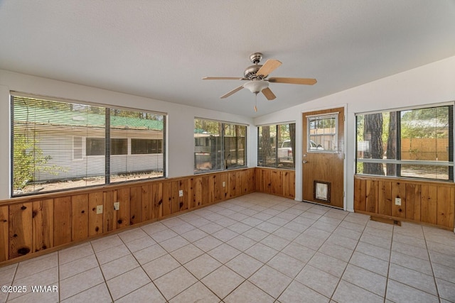1721 W Huning, Show Low, AZ 85901 - unfurnished sunroom with wood walls, healthy amount of natural light, vaulted ceiling, and wainscoting