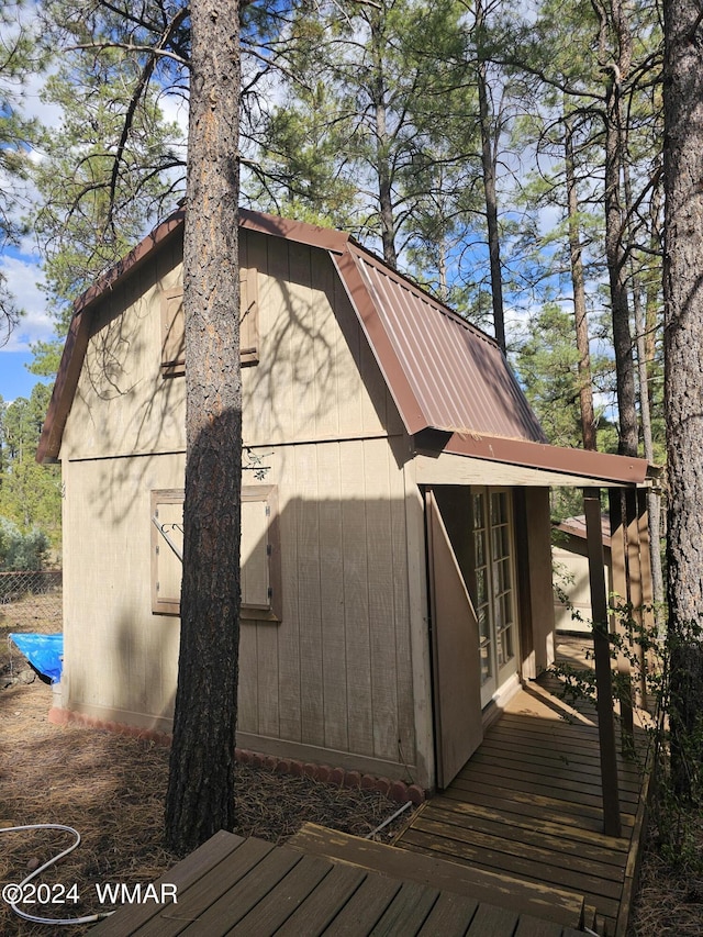 view of side of property featuring metal roof