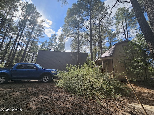 view of yard with an outbuilding and a barn