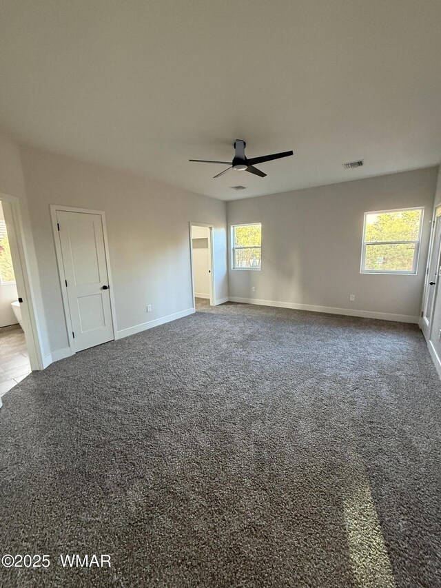 2747 Air Park Dr, Overgaard, AZ 85933 - empty room with a ceiling fan, baseboards, visible vents, and carpet
