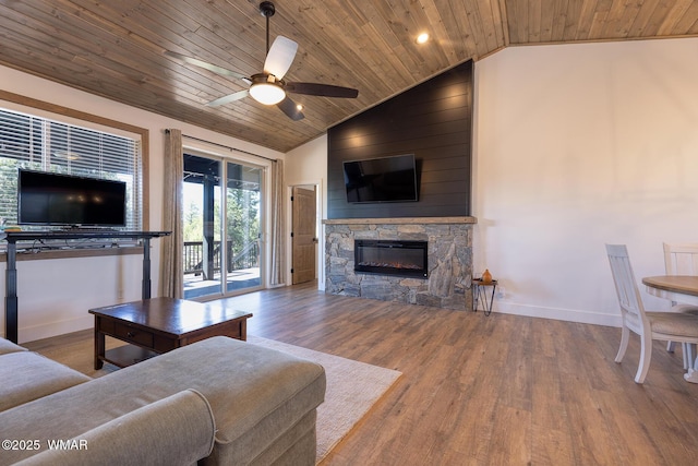living room featuring wooden ceiling, vaulted ceiling, a fireplace, baseboards, and ceiling fan