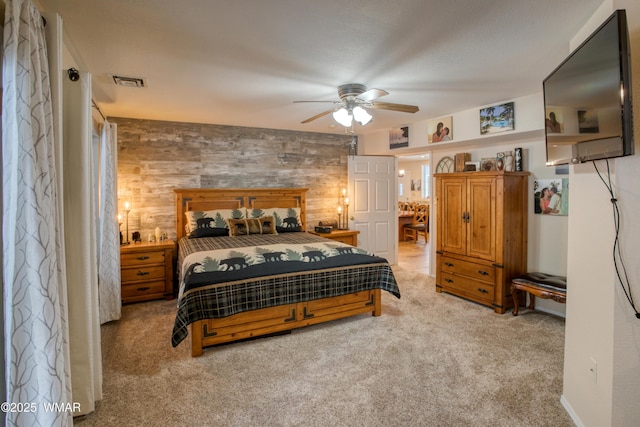 bedroom with light colored carpet and visible vents