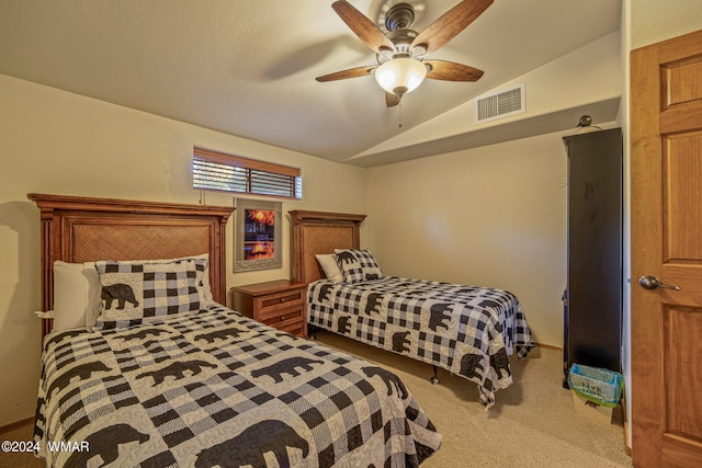 bedroom featuring lofted ceiling, visible vents, a ceiling fan, and light colored carpet