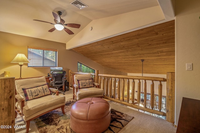 living area with lofted ceiling, visible vents, a ceiling fan, carpet flooring, and wooden ceiling