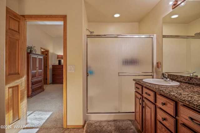 full bathroom featuring vanity and a shower stall