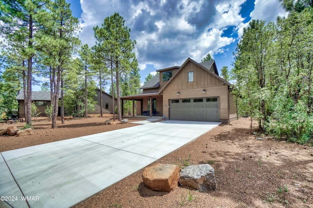 view of front of home with an attached garage and concrete driveway