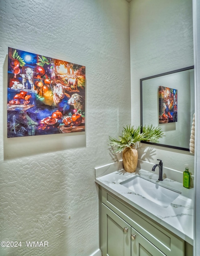 bar with a sink and a textured wall