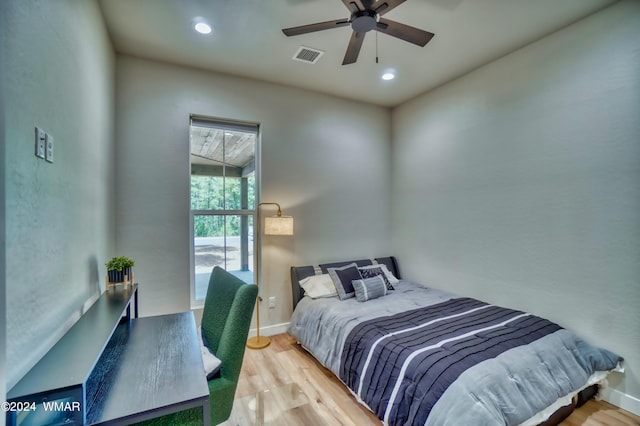 bedroom with ceiling fan, recessed lighting, wood finished floors, visible vents, and baseboards