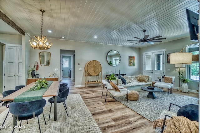 living room with baseboards, recessed lighting, wooden ceiling, and light wood-style floors