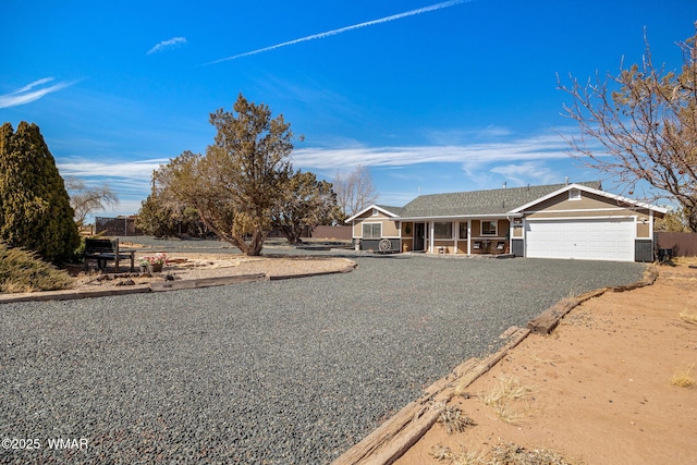 single story home with brick siding, driveway, and an attached garage