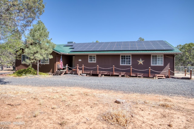 6690 Circle C Ln, Show Low, AZ 85901 - back of property featuring solar panels and a deck