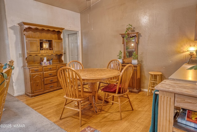 6690 Circle C Ln, Show Low, AZ 85901 - dining room featuring light wood-style flooring and a textured wall