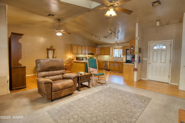 6690 Circle C Ln, Show Low, AZ 85901 - living room featuring ceiling fan, vaulted ceiling, and light wood-type flooring