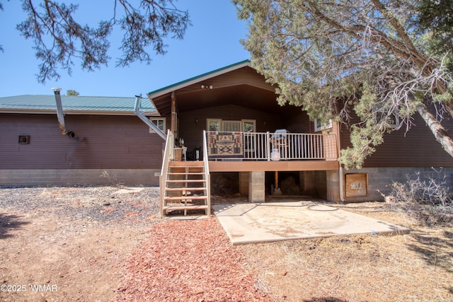 6690 Circle C Ln, Show Low, AZ 85901 - back of property with a deck, a patio, a metal roof, and stairs