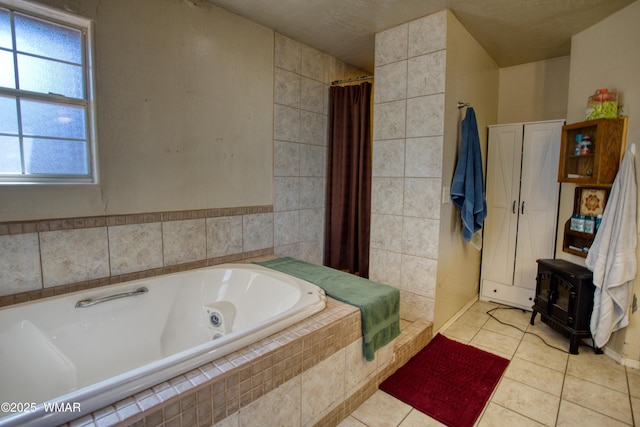 6690 Circle C Ln, Show Low, AZ 85901 - bathroom featuring a jetted tub, a wood stove, tile patterned floors, and a tile shower