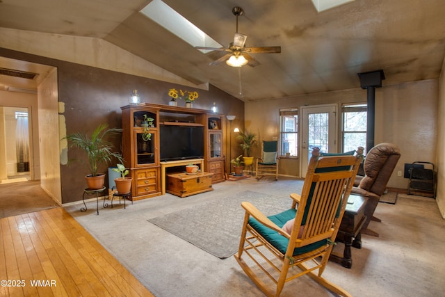 6690 Circle C Ln, Show Low, AZ 85901 - living area featuring a ceiling fan, a skylight, lofted ceiling, and hardwood / wood-style floors