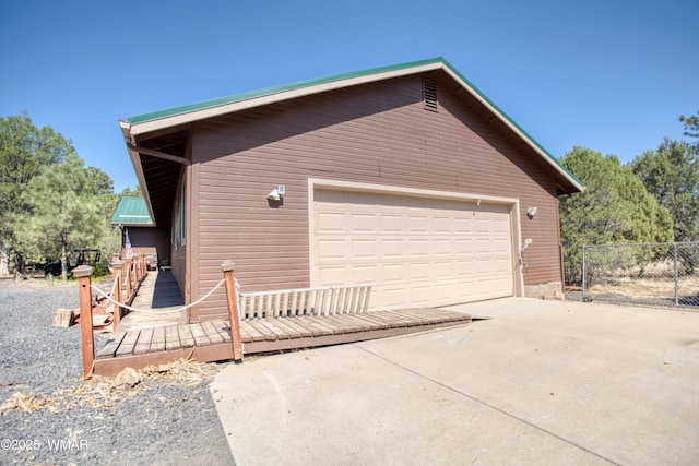 6690 Circle C Ln, Show Low, AZ 85901 - view of property exterior with a garage, an outdoor structure, and concrete driveway