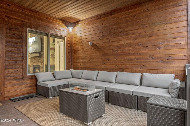 view of patio / terrace featuring an outdoor living space with a fire pit