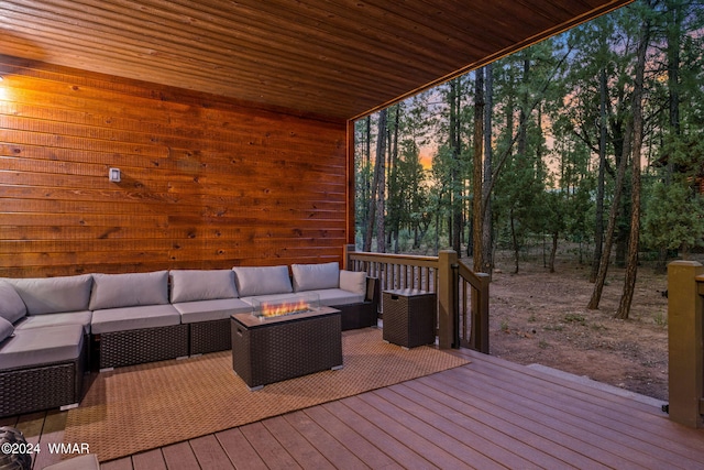 deck at dusk with an outdoor hangout area