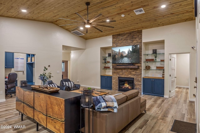 living room featuring built in features, wooden ceiling, and visible vents