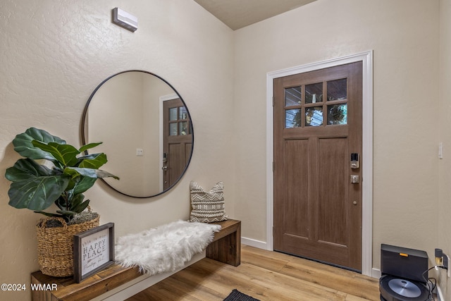 entrance foyer with light wood-style floors and baseboards