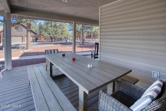 deck featuring outdoor dining area