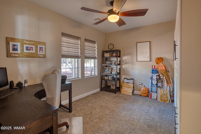 office area featuring baseboards, visible vents, carpet floors, and ceiling fan