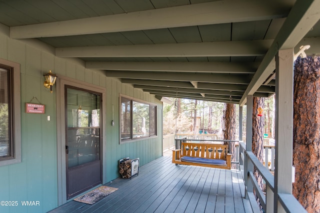 wooden deck featuring covered porch