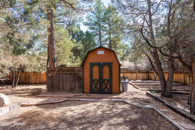 view of shed featuring a fenced backyard