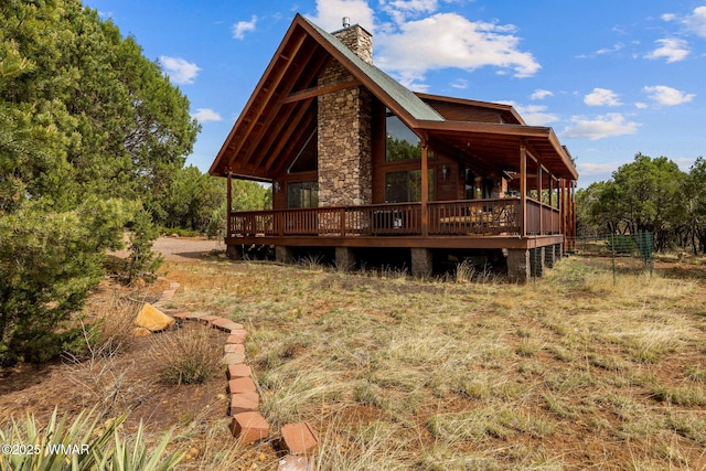 1537 Georgann Cir, Heber, AZ 85928 - back of property featuring a chimney, a wooden deck, and stone siding