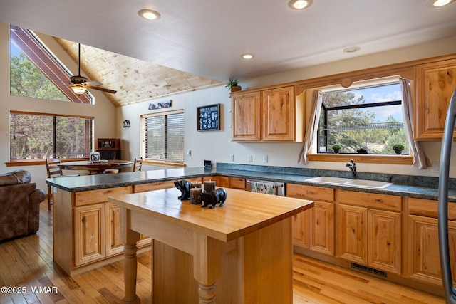 1537 Georgann Cir, Heber, AZ 85928 - kitchen featuring wooden counters, a peninsula, healthy amount of natural light, lofted ceiling, and light wood-type flooring