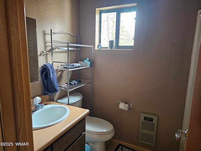 4989 Drifting Snow Loop Unit 4, Pinetop, AZ 85935 - bathroom with vanity, heating unit, and toilet