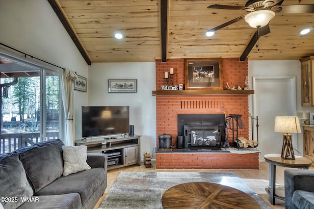 living room featuring vaulted ceiling with beams, light wood-type flooring, wooden ceiling, and a ceiling fan